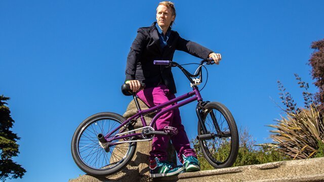 Timothy Radley looks into the distance beside his BMX bicycle