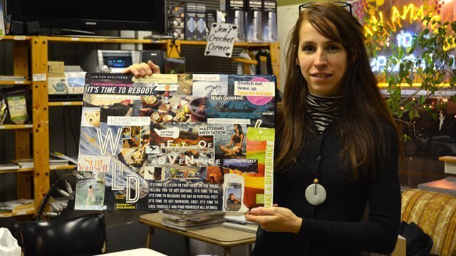 Deanna Husk holds a vision board she created