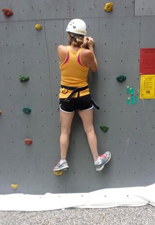 Cassandra Glynn Kutner is rock climbing