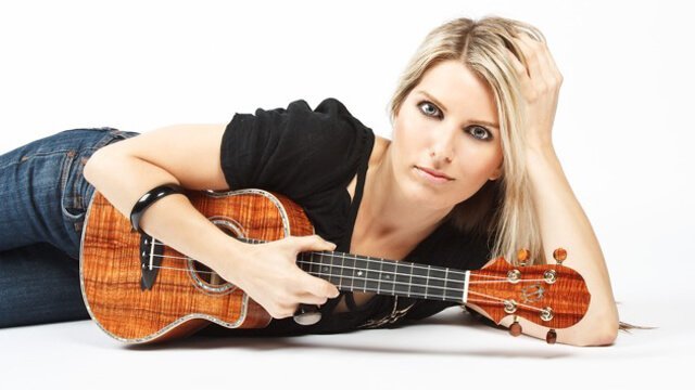 Alicia Grant poses while holding a ukelele