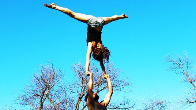 Brittany Taylor and Noah practice acroyoga