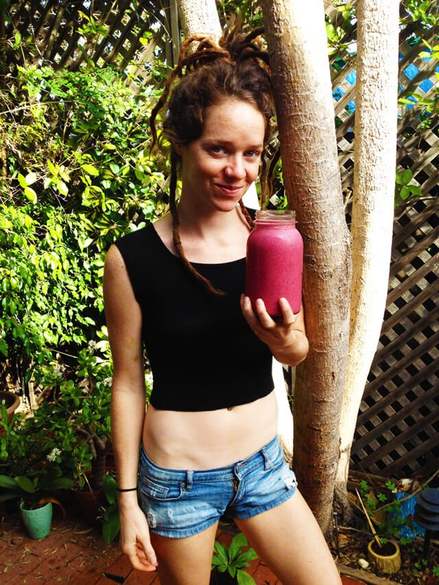 Brittany Taylor holds a dark-red smoothie in Santa Barbara