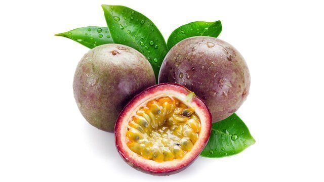 Passion fruit whole and halved on white background