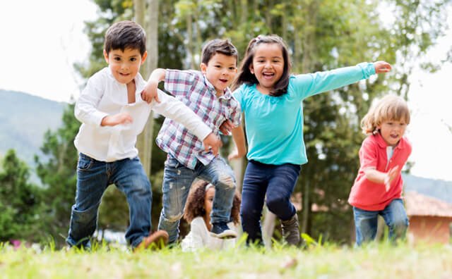 A group of kids plays in a park