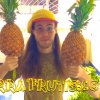 Peter Csere holds pineapples with TerraFrutis.com emblazoned on the photo