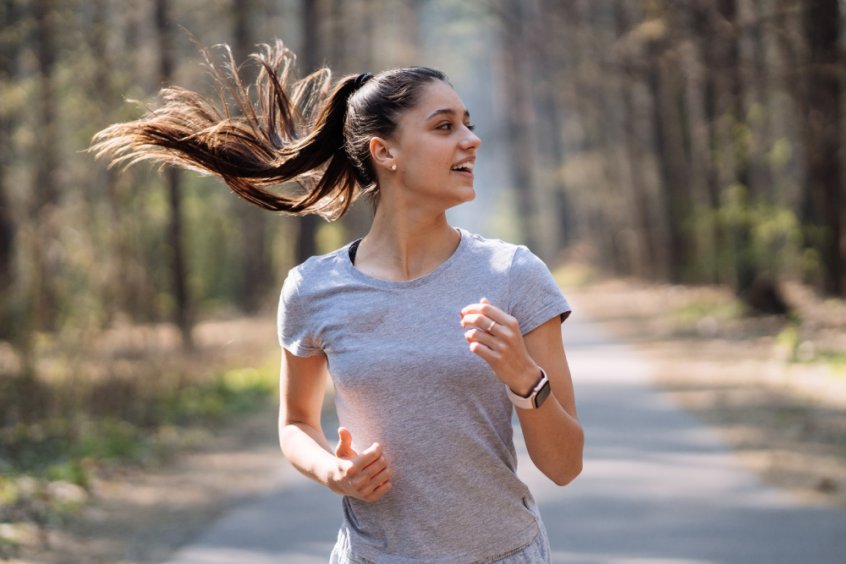 Woman running in a park - Fruit-Powered