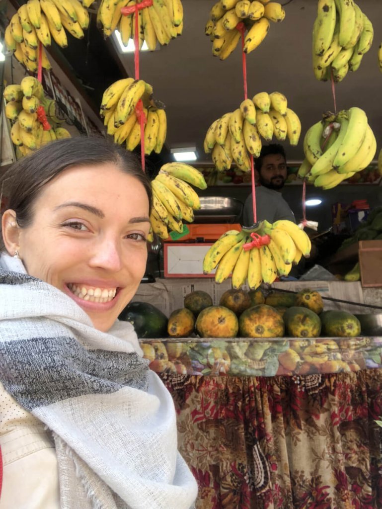 Kristina Poudyal - with bananas - Nepal fruit market - Fruit-Powered