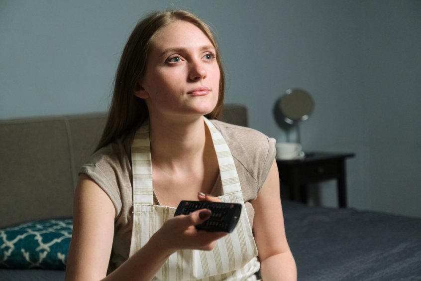 COVID - woman watching TV news - Fruit-Powered